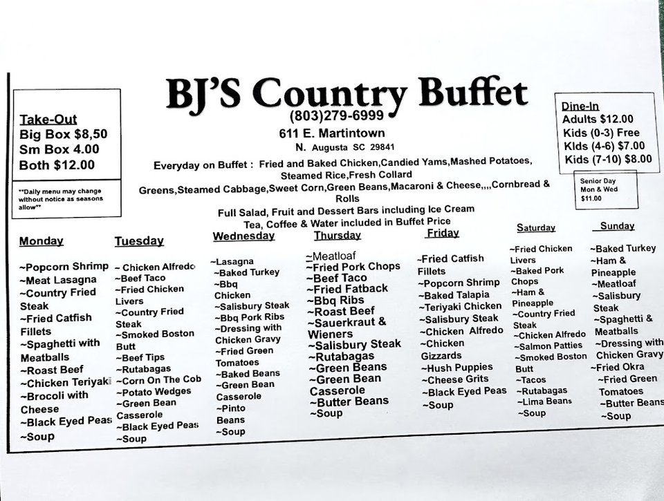 Buffet selection with fried chicken and side dishes.